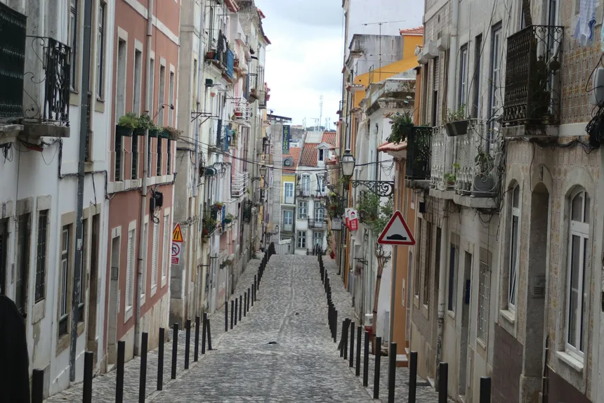 A sloping road surface running away downhill, the half of the hill question nobody asks about