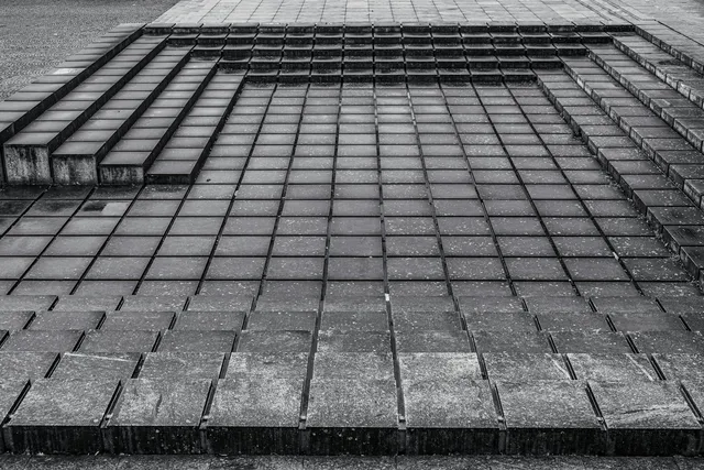 A short flight of steps, the everyday movement a stand-over height is measured against