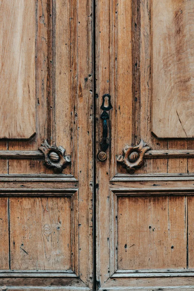 A pair of closed cupboard doors with metal handles, the only barrier on this page that actually works